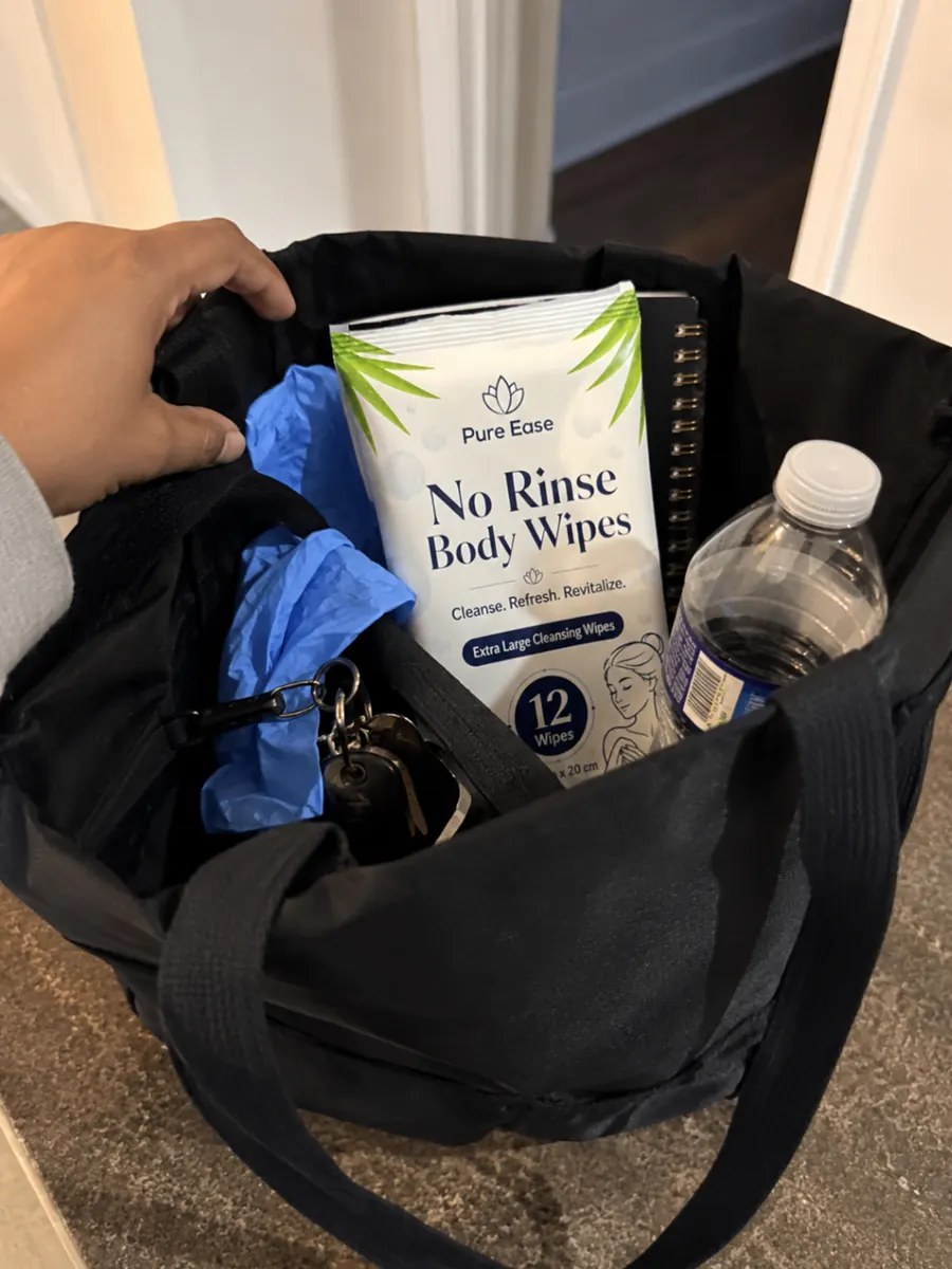 PureEase body wipes in a tote bag with everyday care items.