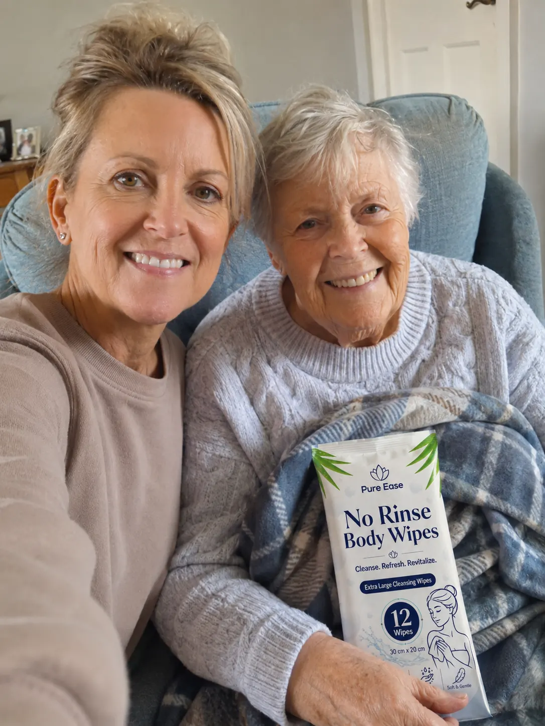 Smiling family carer and elderly loved one with PureEase No Rinse Body Wipes at home